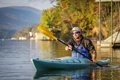 The Feelfree Aventura 125 V2 kayak being paddled across a calm lake