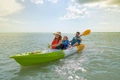 The Feelfree Corona Family Kayak shown paddling in coastal waters