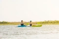 The Feelfee Gemini Sport Two Person Kayak shown paddling along a river