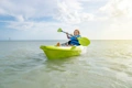 The Feelfree Move kayak shown being paddled along coastal waters