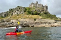 The Feelfree Nomad Sport paddling past Saint Michaels Mount