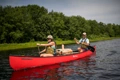 The Old Town Discovery 158 being paddled along a river