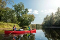 The Old Town Penobscot Canoe being paddled along a river