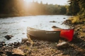 The Old Town Penobscot Canoes shown at the side of a river