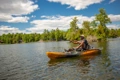 The Old Town Sportsman Salty Pedal Kayak shown casting a fishing rod