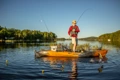 The Old Town Sportsman Salty angler standing up to cast a fishing rod