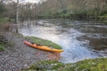 The Riot Edge 15 kayak shown on the side of the River Conwy