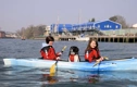 Old Town Twin Otter kayak paddling along a river